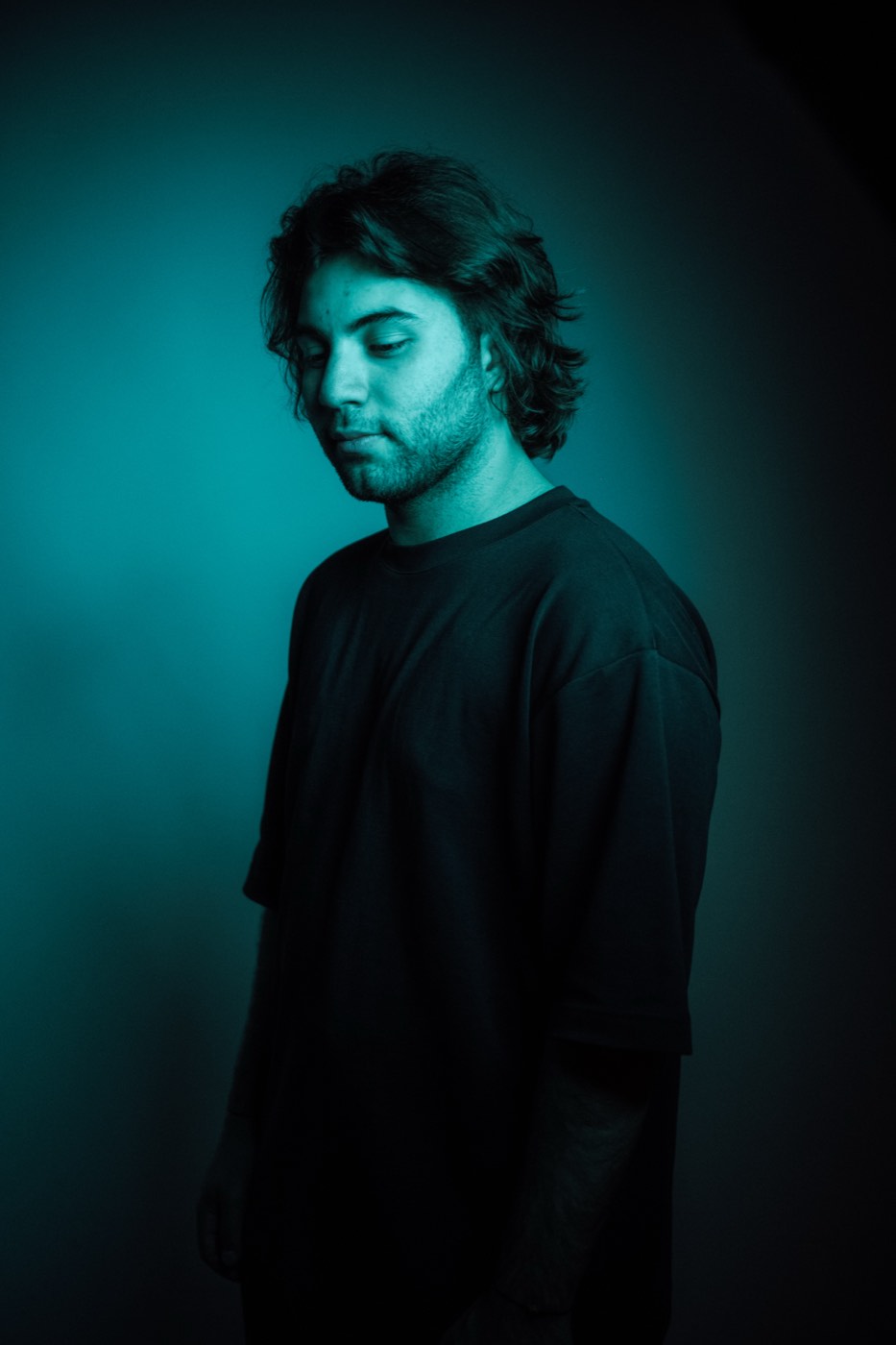 A DEEN portrait in teal light